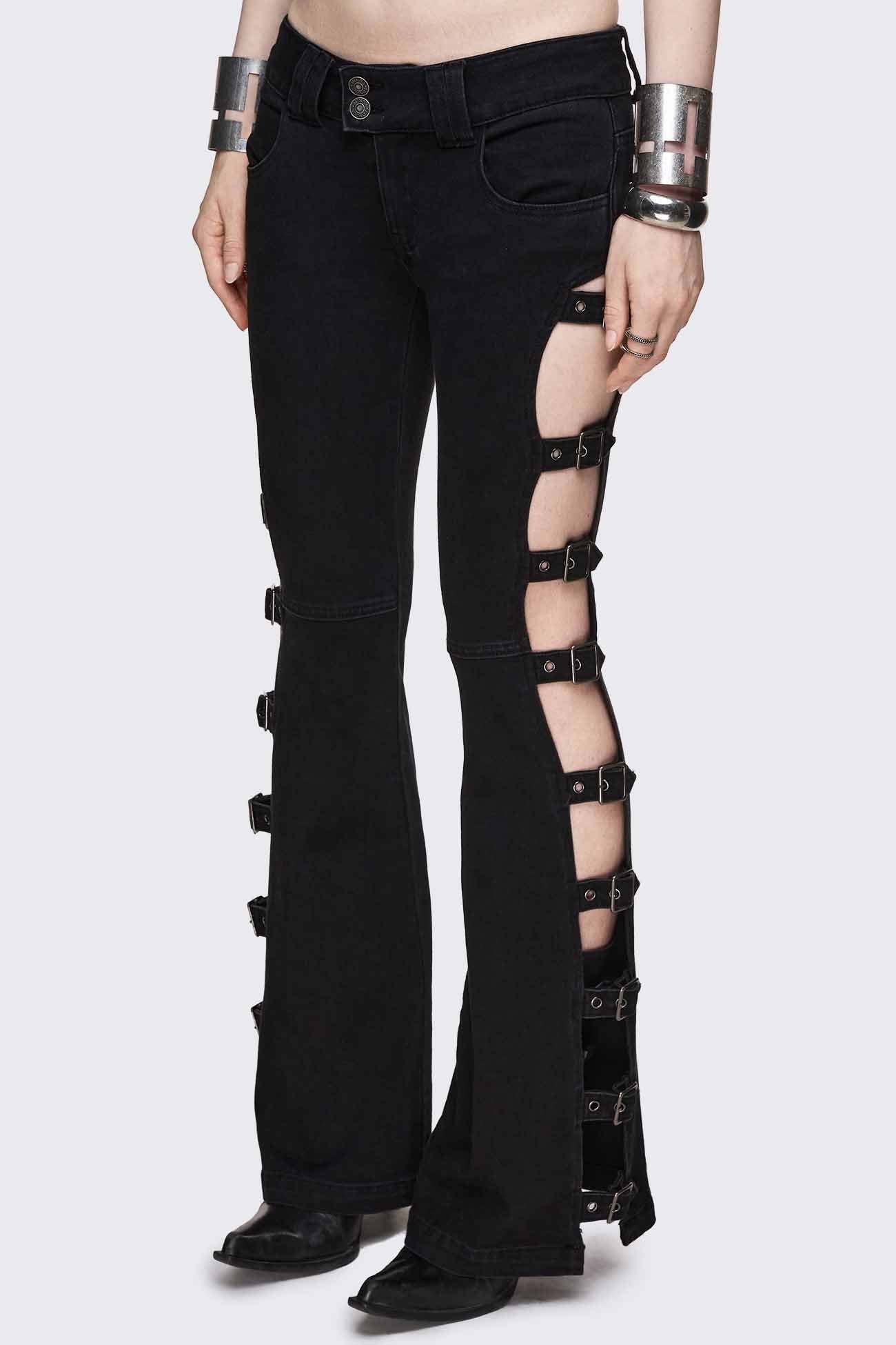 Black low rise flared jeans with buckle-strap side cut-outs and silver-tone hardware.