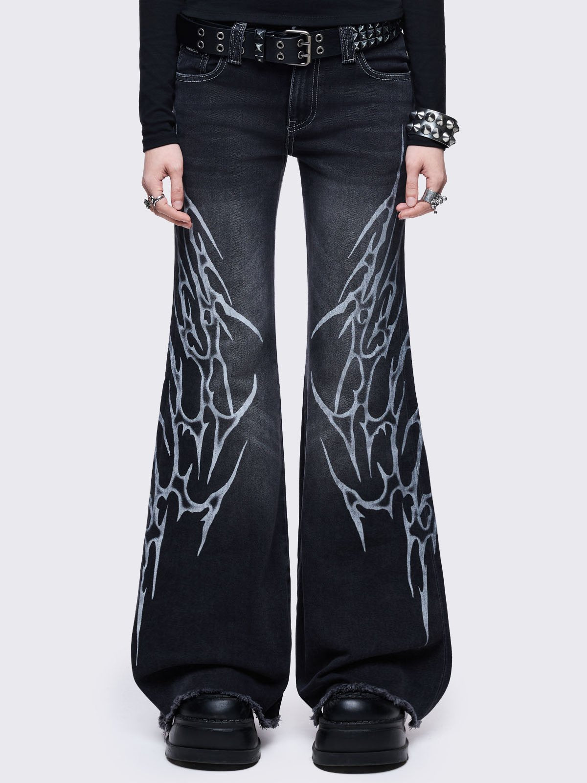 Black washed flared jeans with sigilism side print.
