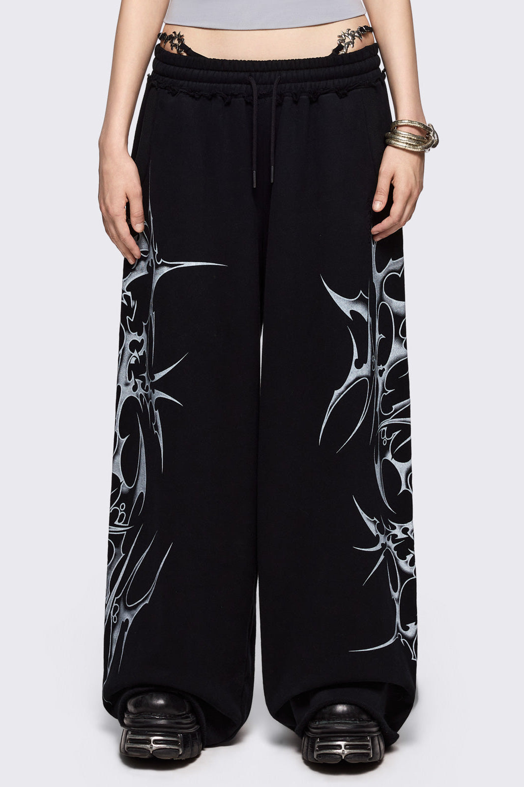 Black wide leg sweatpants with off-white sigilism graphic side print.
