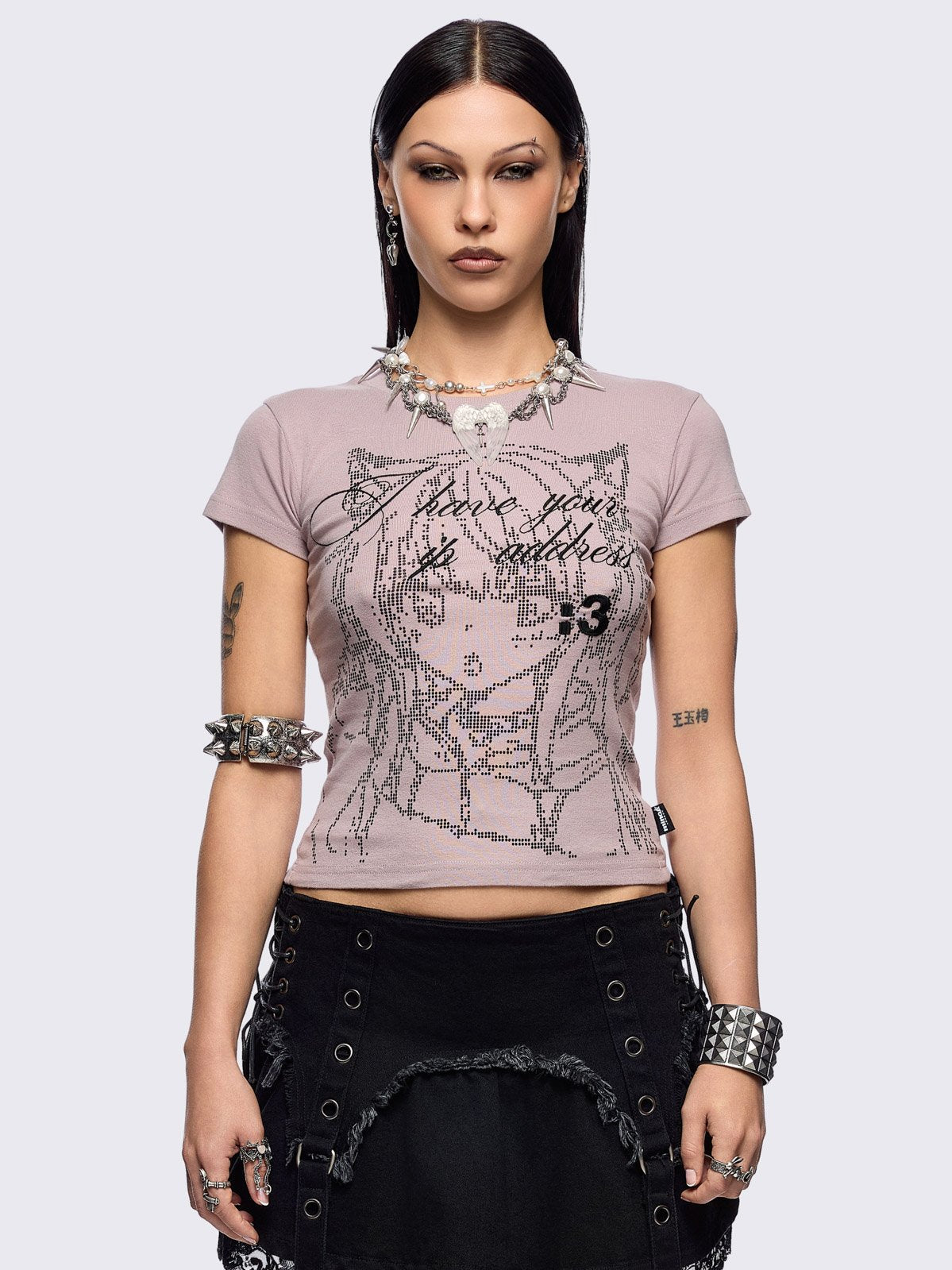 Pink baby tee with "I have your IP address" embroidery and anime girl ASCII-style graphic print.