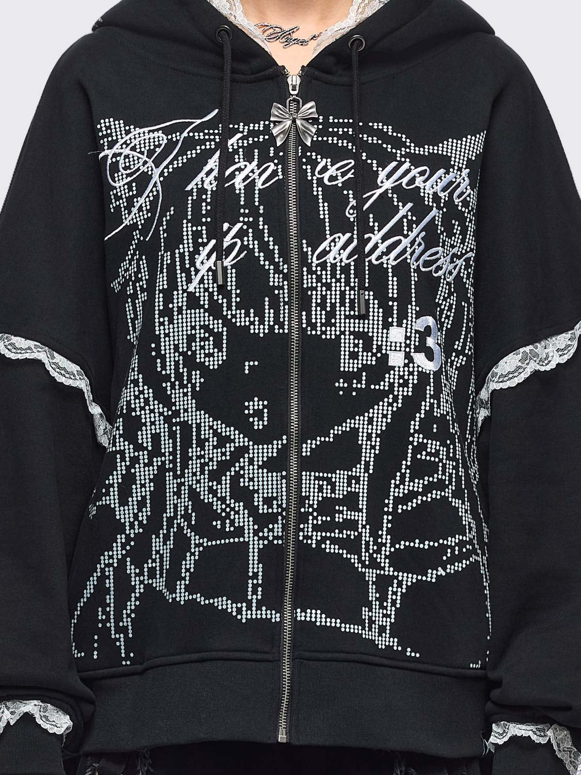Black oversize zip up hoodie jacket with "I have your IP address" embroidery, anime girl ASCII-style graphic print and white lace seam details.