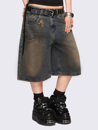 Blue washed longline denim jorts featuring a green overdye, removable chain, wide-leg fit and knee-length cut.