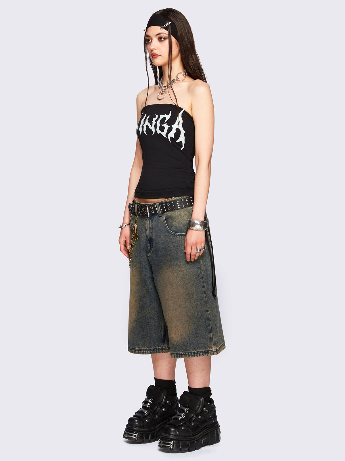 Blue washed longline denim jorts featuring a green overdye, removable chain, wide-leg fit and knee-length cut.
