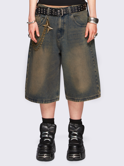 Blue washed longline denim jorts featuring a green overdye, removable chain, wide-leg fit and knee-length cut.