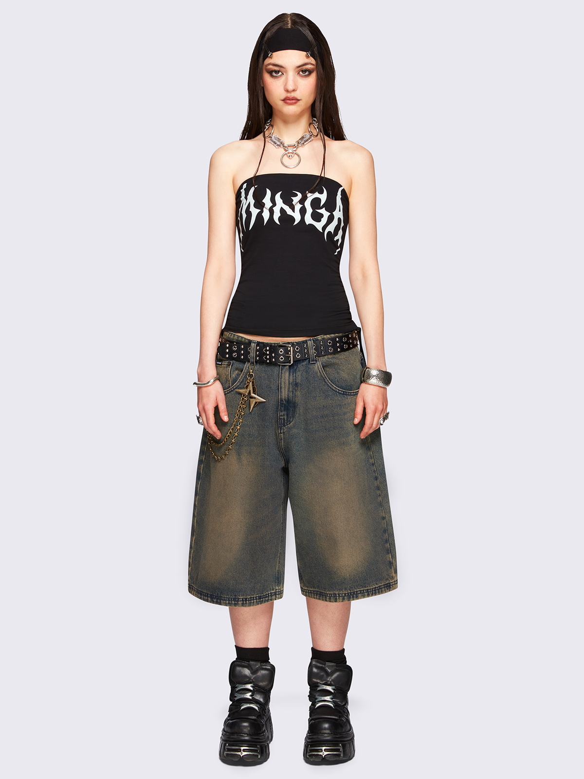 Blue washed longline denim jorts featuring a green overdye, removable chain, wide-leg fit and knee-length cut.
