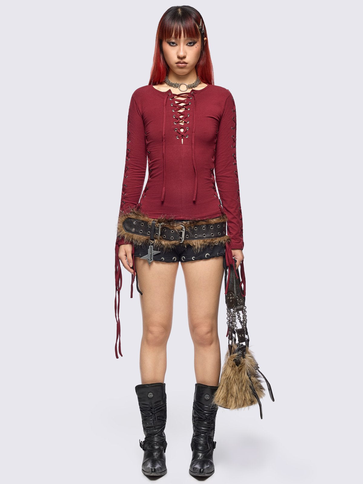 Burgundy long sleeve top with lace-up details.