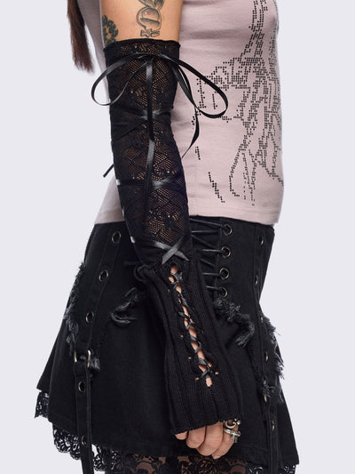 Black knit arm warmers featuring fishnet layer and lace up details.