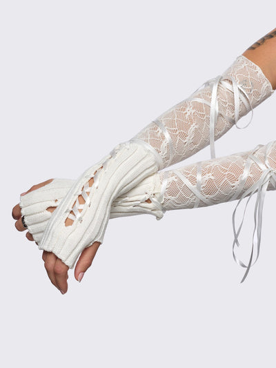 White knit arm warmers with fishnet layer and lace up details.