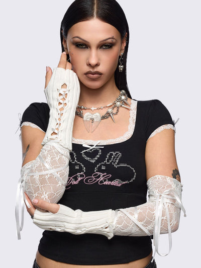 White knit arm warmers with fishnet layer and lace up details.