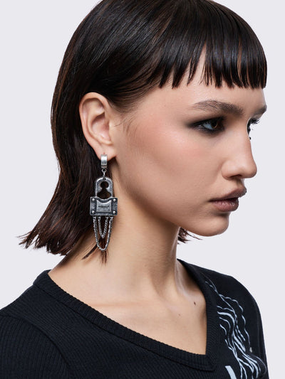 Chunky silver padlock pendant hoop earrings.