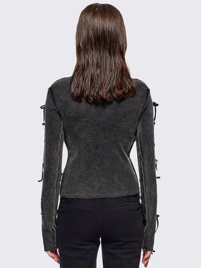 Black washed rib top with cut-out and bow details.