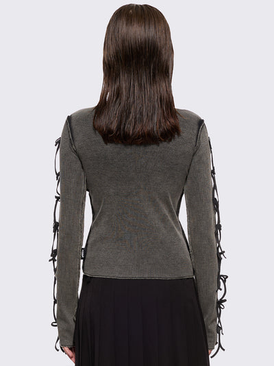 Grey washed rib top with cut-out and bow details.