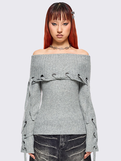 Grey off-shoulder knitted sweater with lace up details.