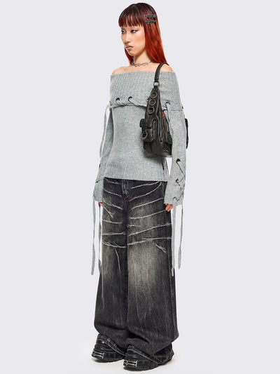 Grey off-shoulder knitted sweater with lace up details.