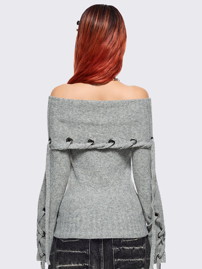 Grey off-shoulder knitted sweater with lace up details.