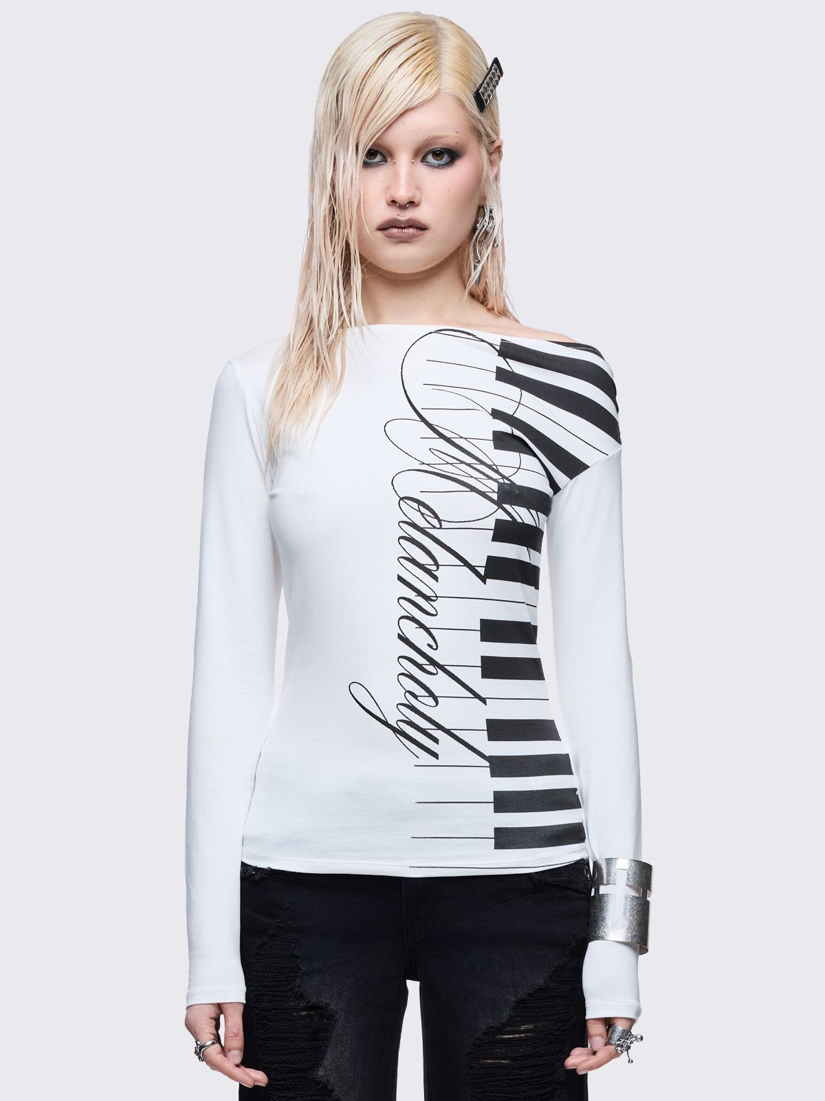 White off shoulder top with piano graphic print.