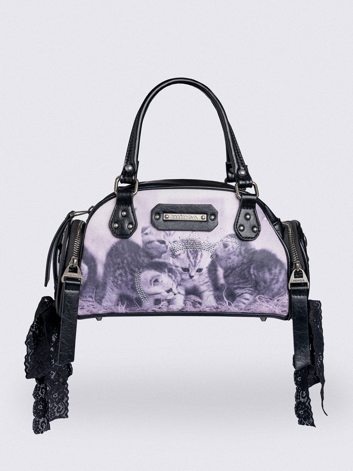Black and pink bowling bag with kittens graphic print, rhinestone details and side exterior pockets with lace up bows.