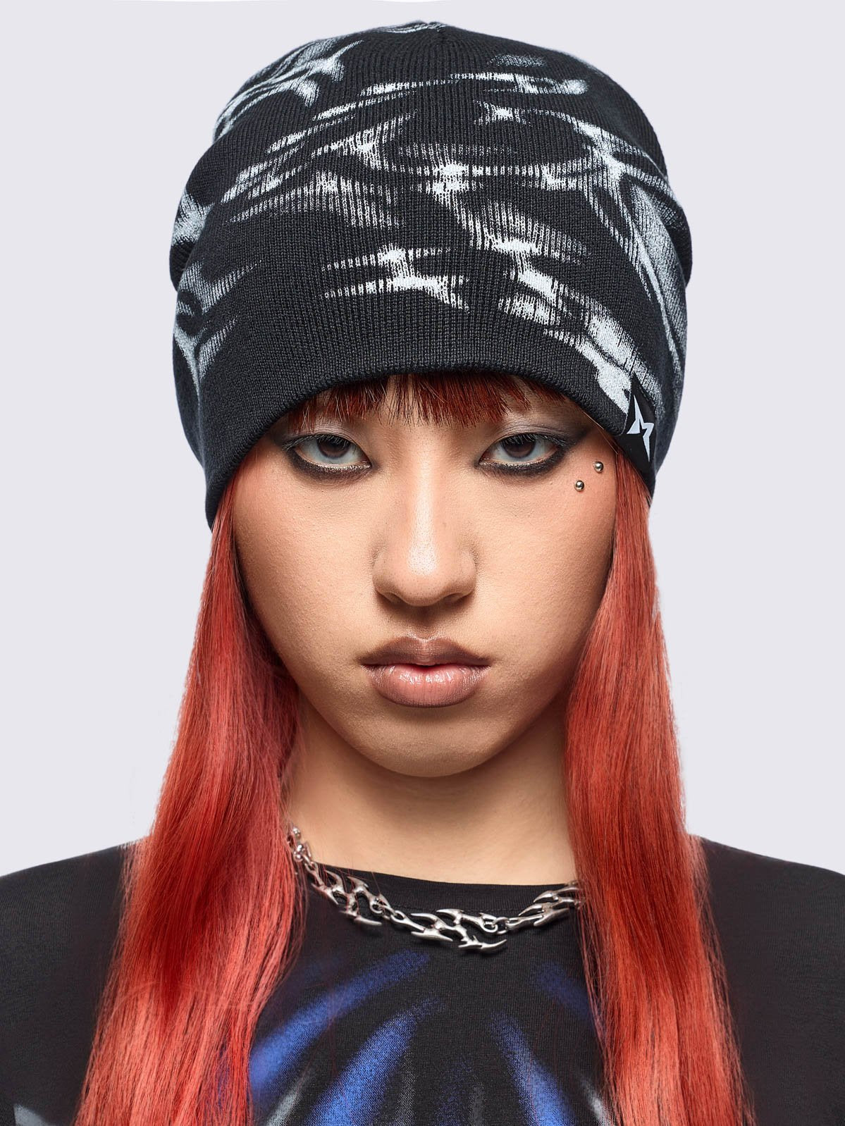 Black beanie hat featuring a graphic print by cold𝐹33t.