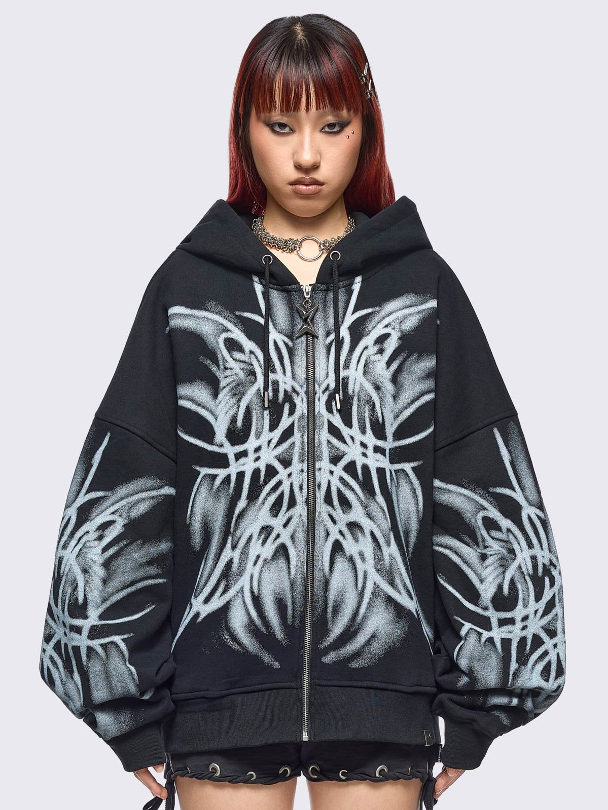 Black zip up hoodie jacket with graphic front and sleeves print by coldfeet designer.