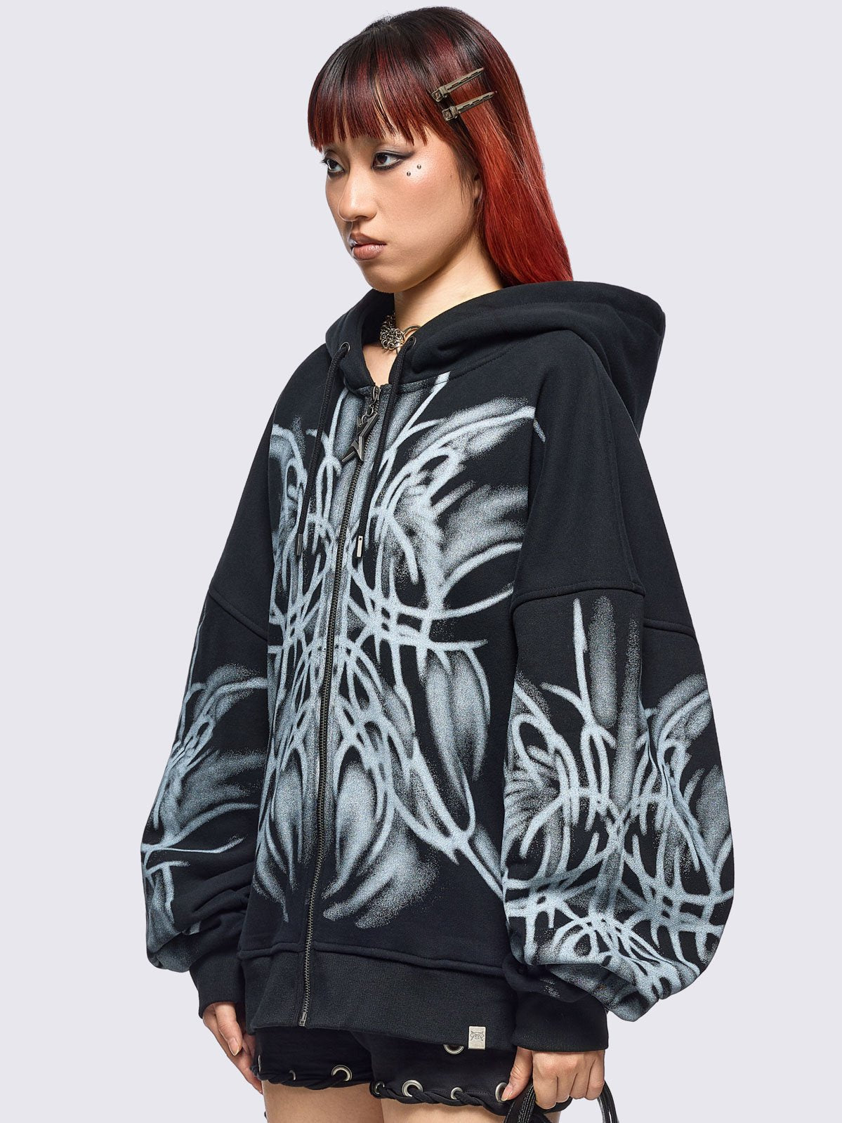 Black zip up hoodie jacket with graphic front and sleeves print by coldfeet designer.