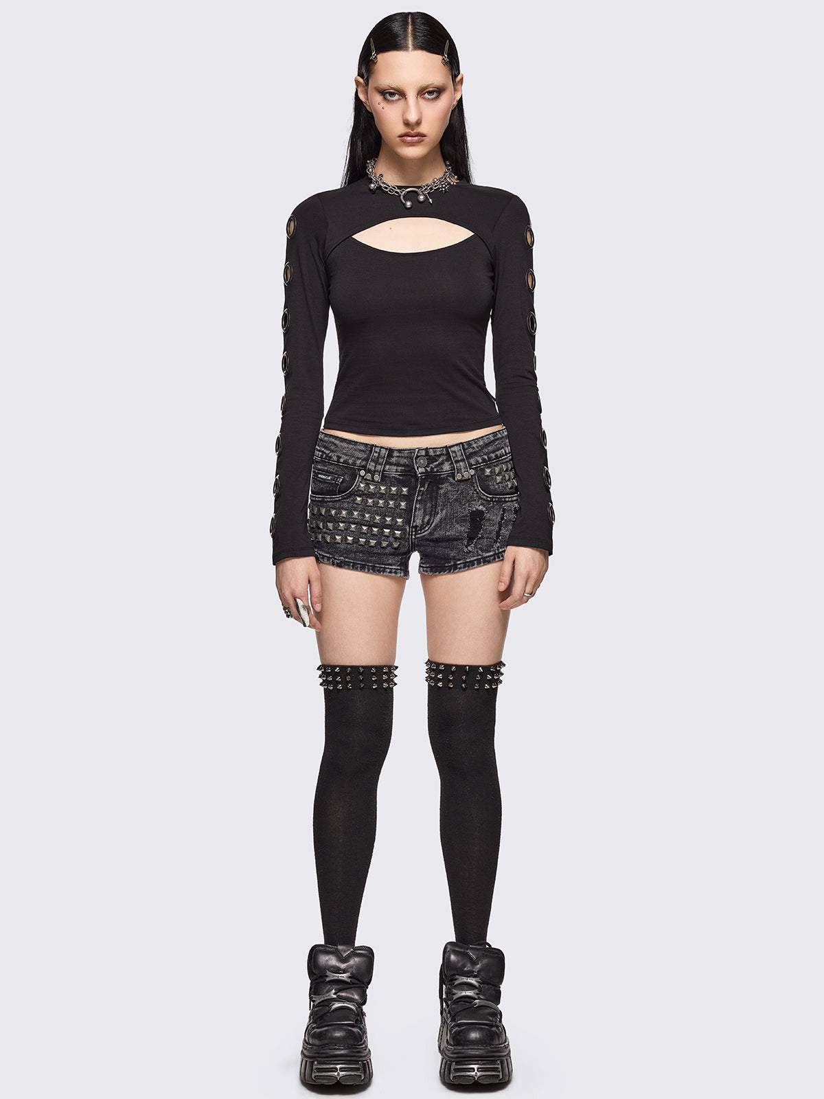 Black cut-out top with chunky silver eyelets.
