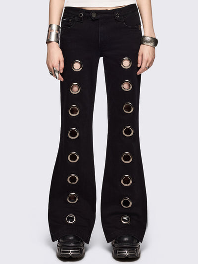 Black flared jeans with chunky silver eyelets.