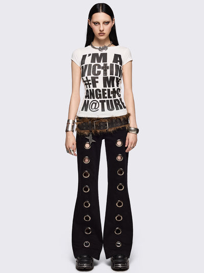 Black flared jeans with chunky silver eyelets.