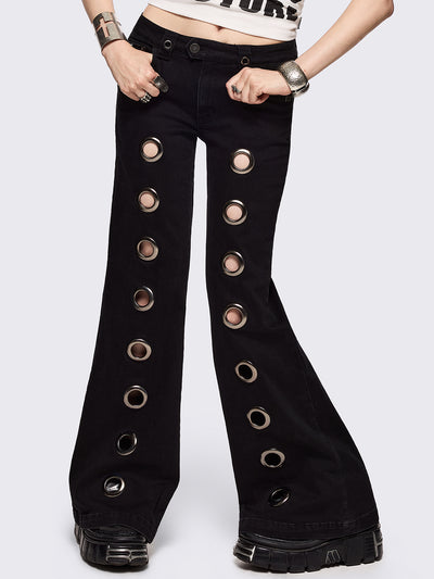 Black flared jeans with chunky silver eyelets.