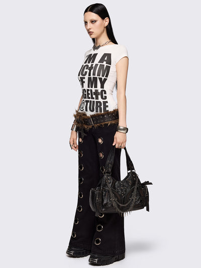 Black flared jeans with chunky silver eyelets.