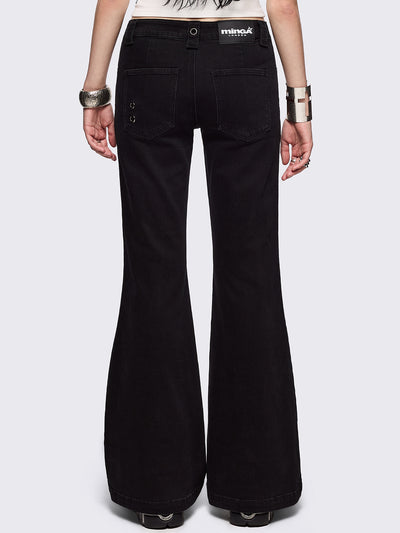 Black flared jeans with chunky silver eyelets.