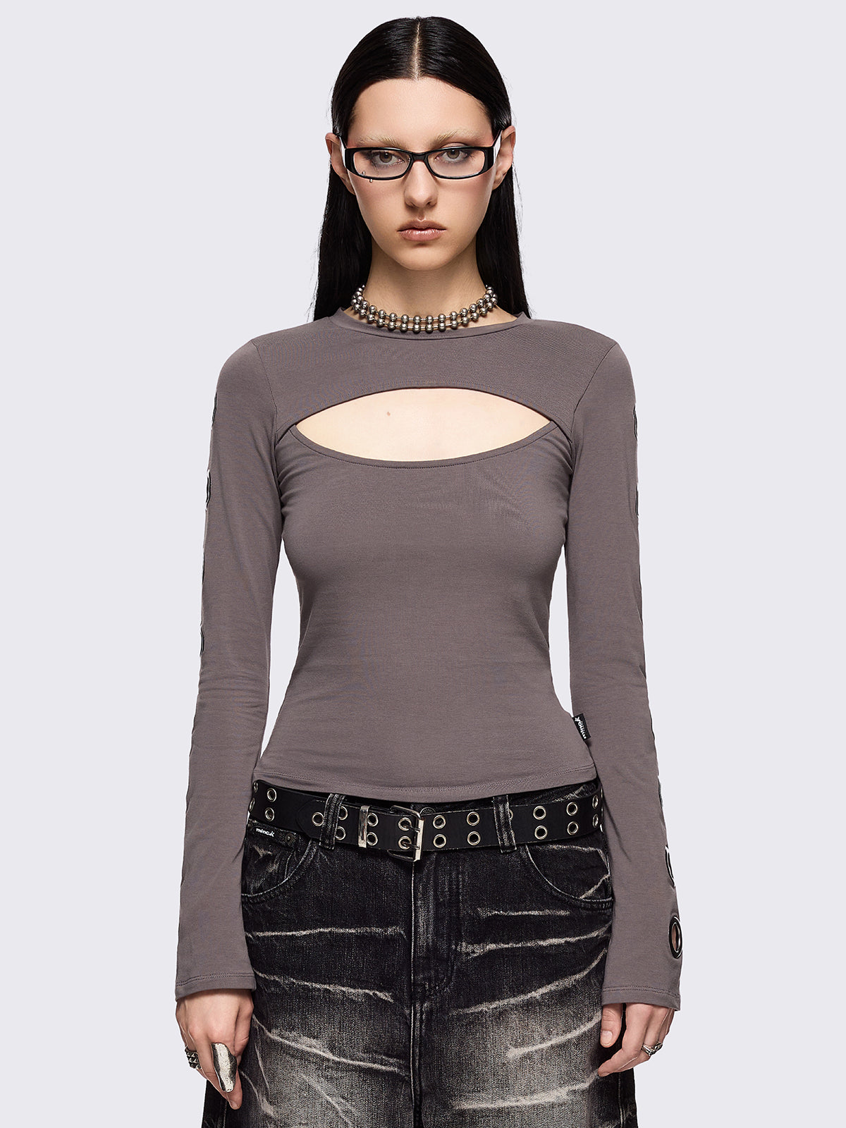 Grey cut-out long sleeve top with chunky silver eyelets on sleeves.