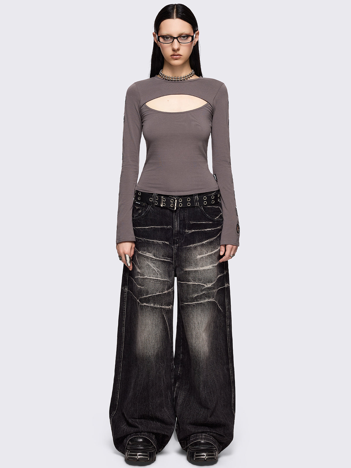 Grey cut-out long sleeve top with chunky silver eyelets on sleeves.