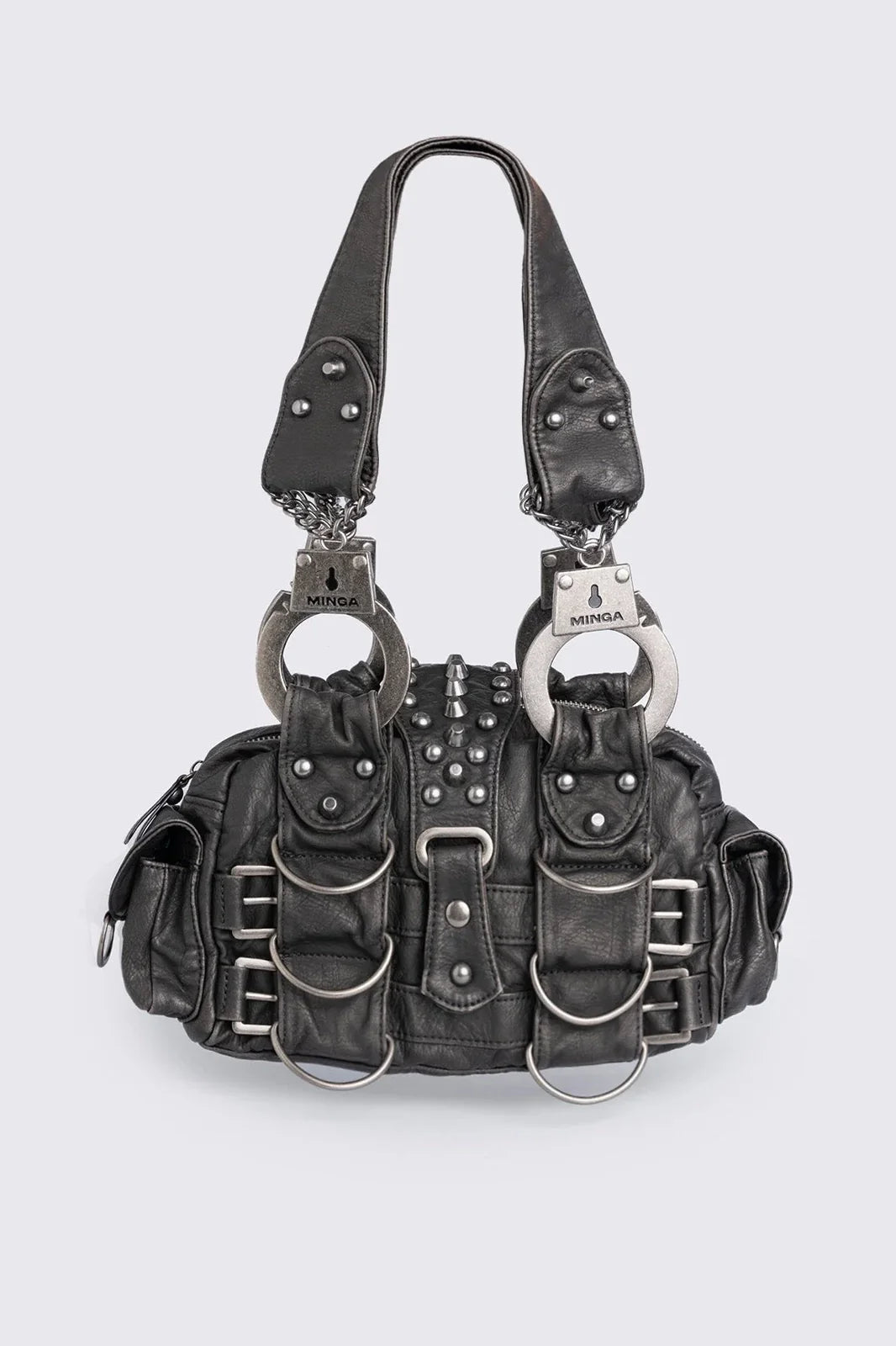 Black vegan leather shoulder bag with handcuffs handles, D-ring, buckle and stud details. Multiple pockets and zip top closure.