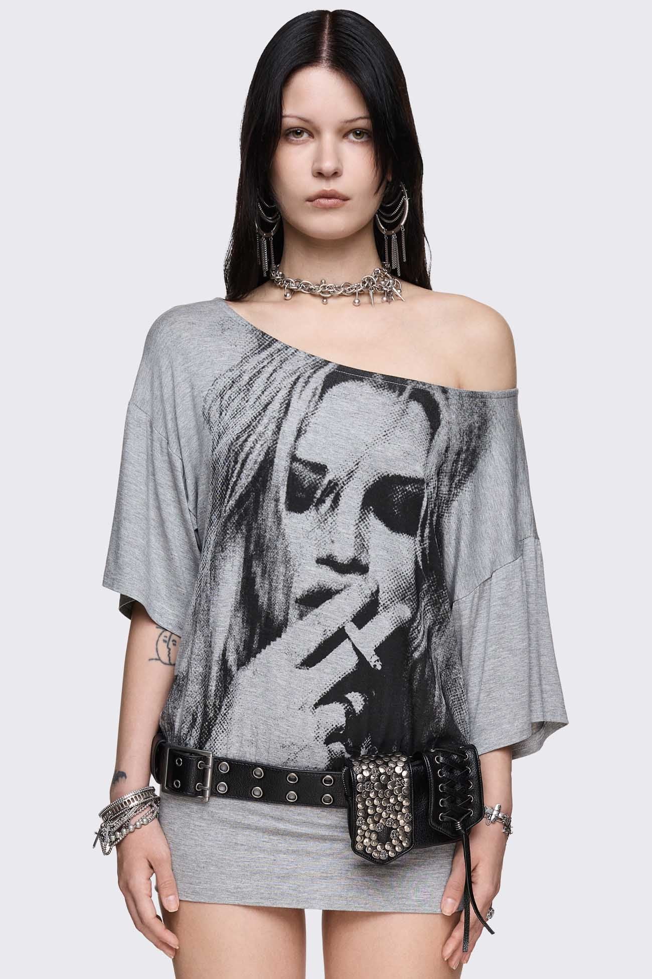 Gray marl off-shoulder top with smoking girl graphic, asymmetrical neckline and grunge vibe.