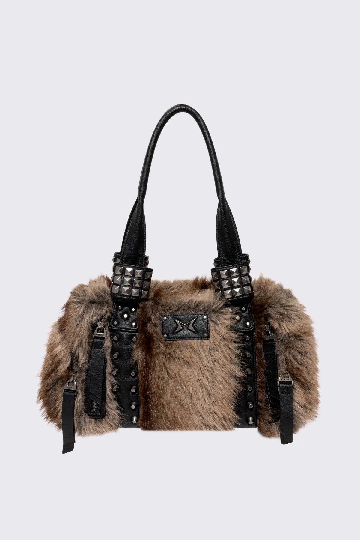 Brown faux fur shoulder bag with black faux leather panels, multiple pockets and pyramid stud hardware.