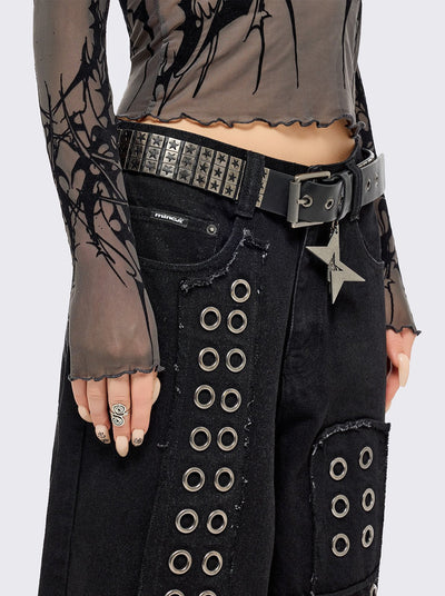 Black vegan leather buckle belt with silver studs in star design. 