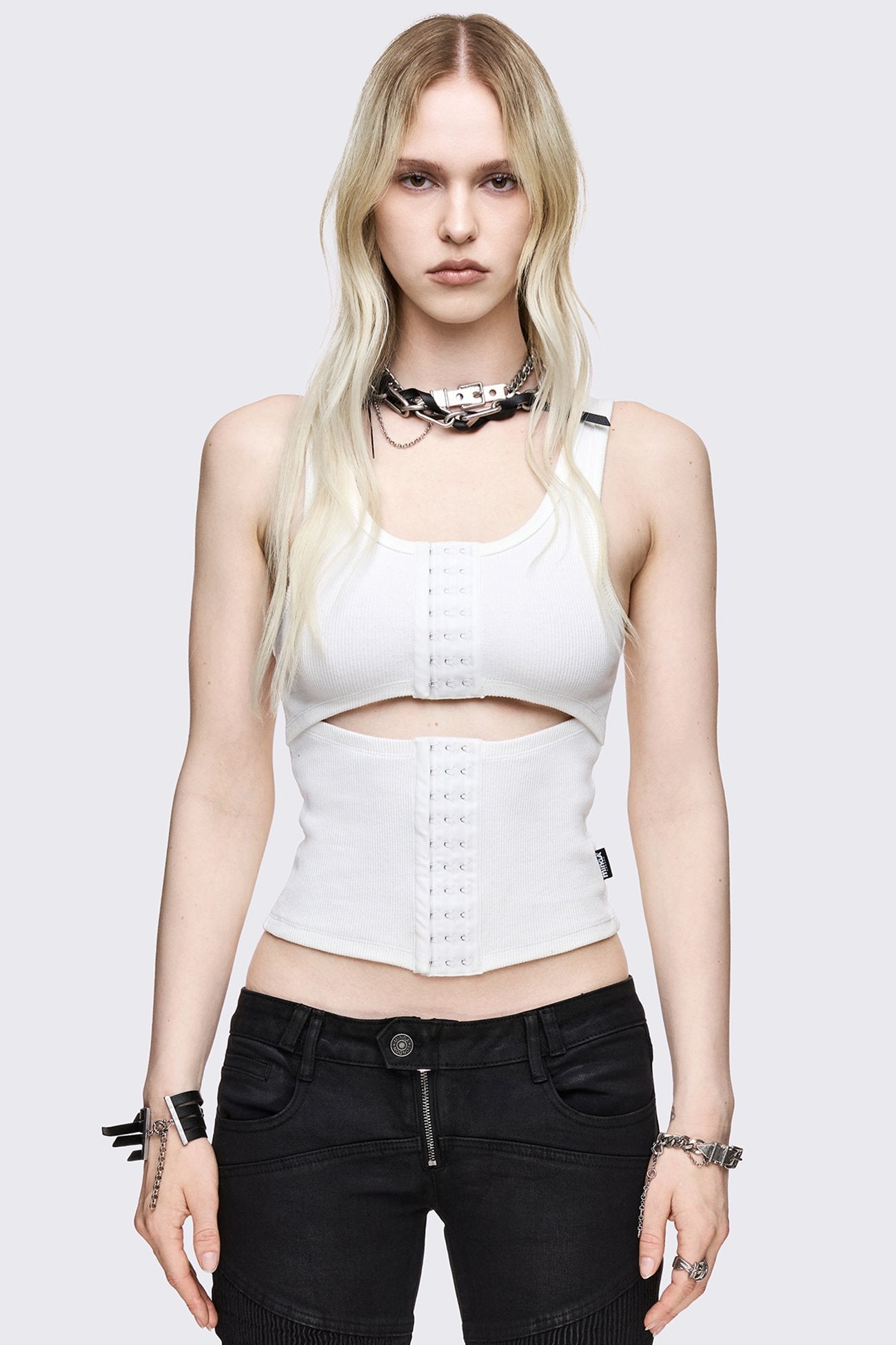 White ribbed tank top with hook-and-eye front, underbust cut-out, scoop neck and cropped slim fit.