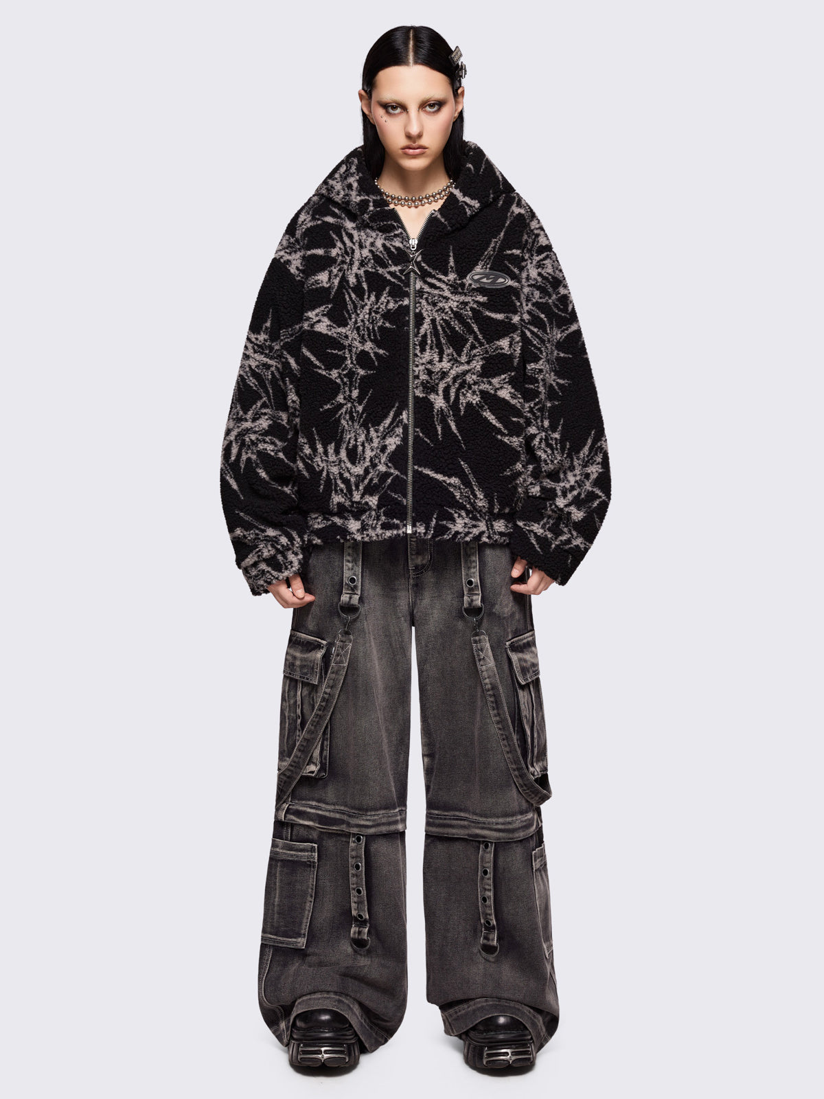Black fleece borg hoodie jacket featuring all over grey thorns design.
