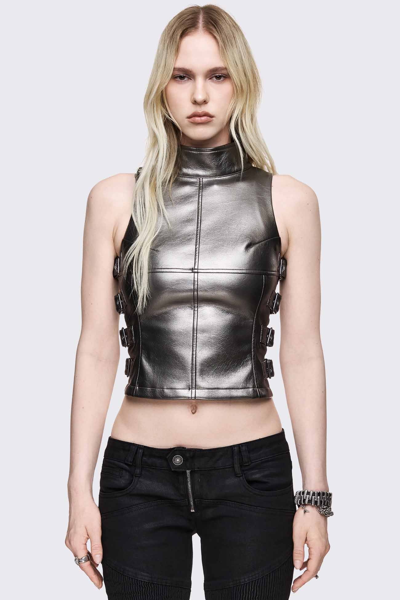 Dark silver faux leather top with open sides, side buckles, high funnel neck and sleeveless fitted shape.