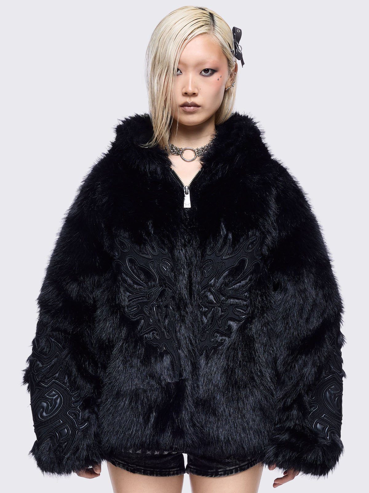 Black faux fur hoodie jacket with sigilism patches on front and sleeves
