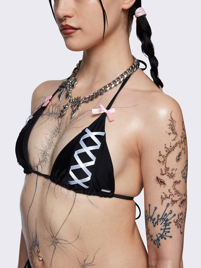Halter neck triangle bikini top in black with contrast lace up in white and bow details in pink