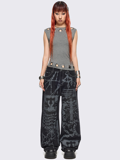Black baggy wide leg jeans featuring a multi grunge graphic prints with white contrast stitching.