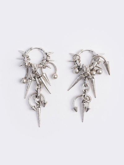 Silver chunky hoop earring with spike and piercing pendants.