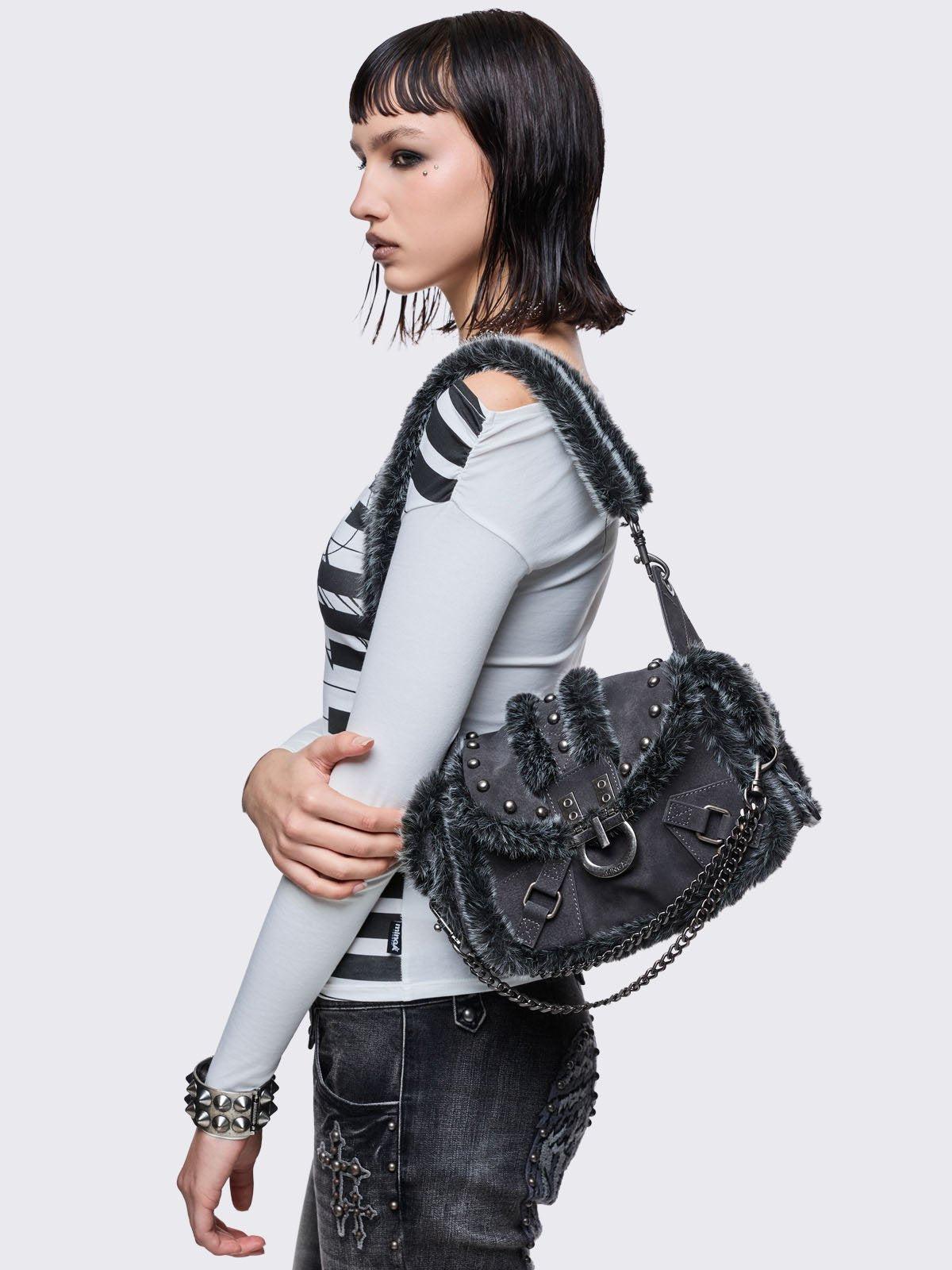 Black vegan shoulder bag with black and grey faux frosted fur and silver stud and hardware details 