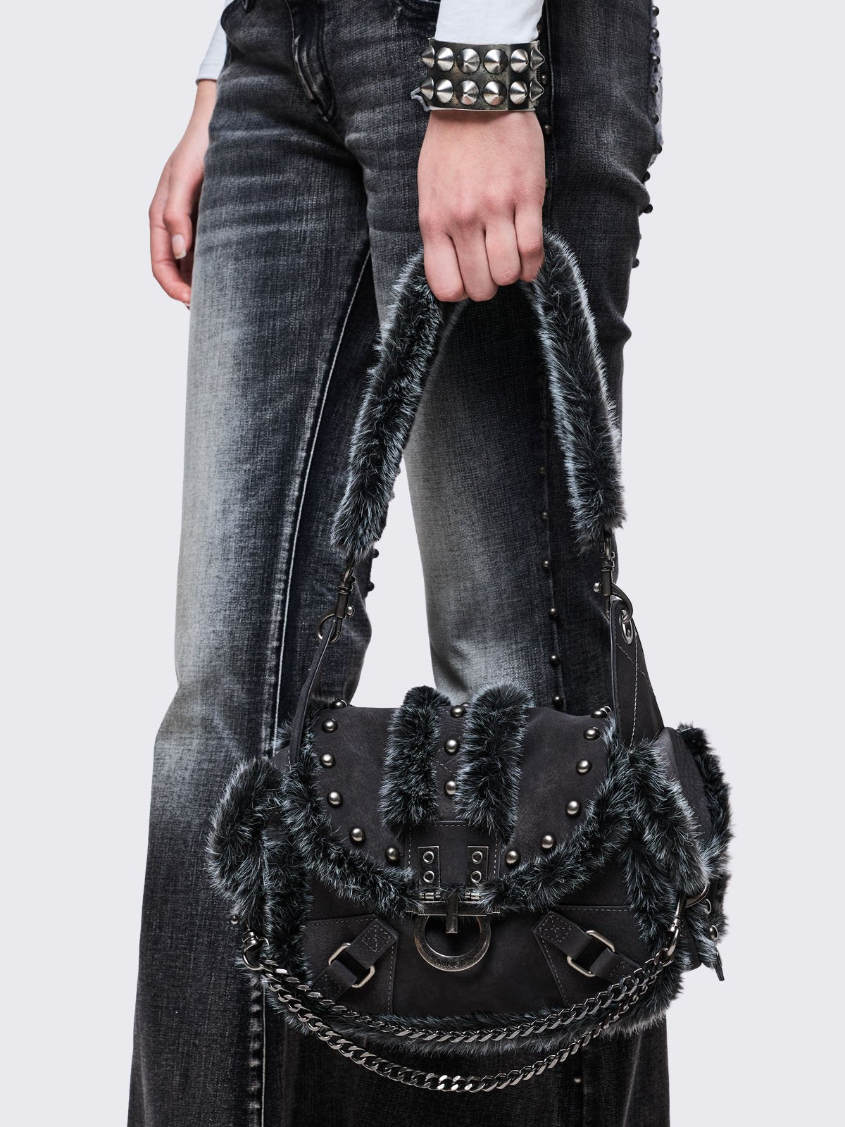 Black vegan shoulder bag with black and grey faux frosted fur and silver stud and hardware details 