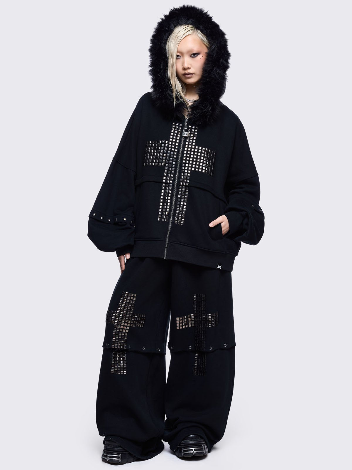 Black sweatpants with silver studded cross, "Reverse" patch back and detachable-leg .