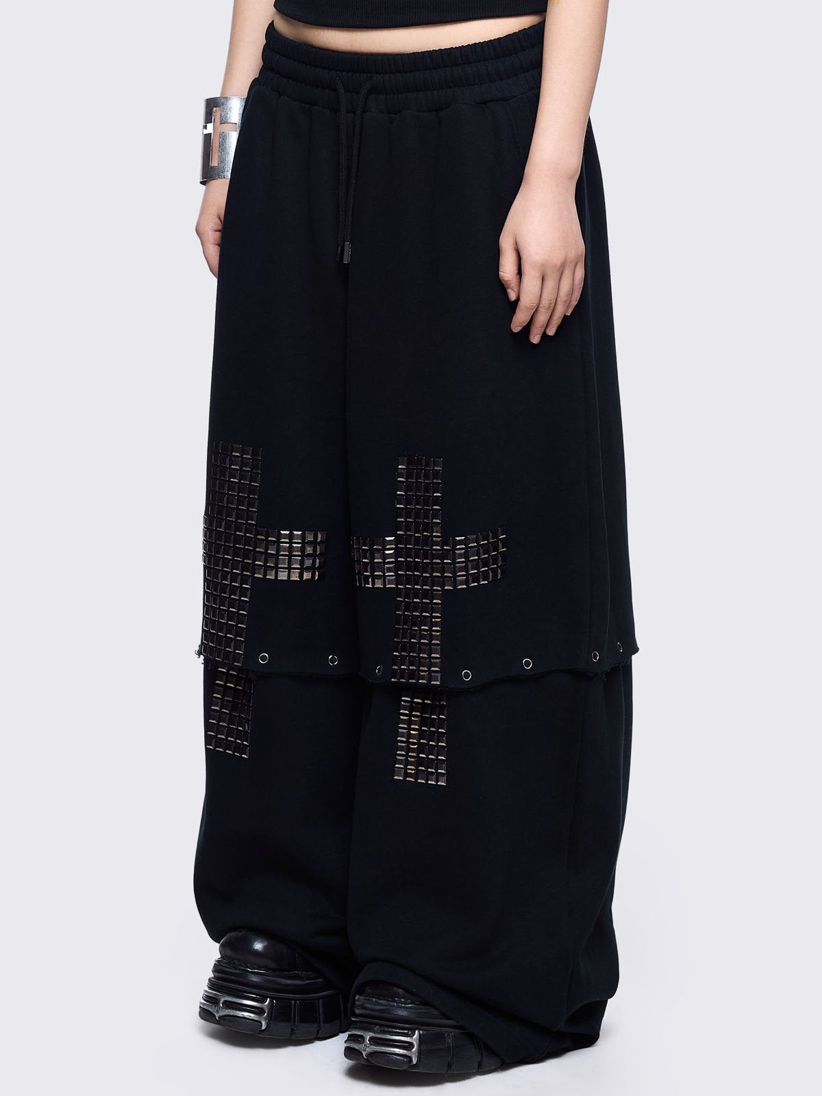 Black sweatpants with silver studded cross, "Reverse" patch back and detachable-leg .