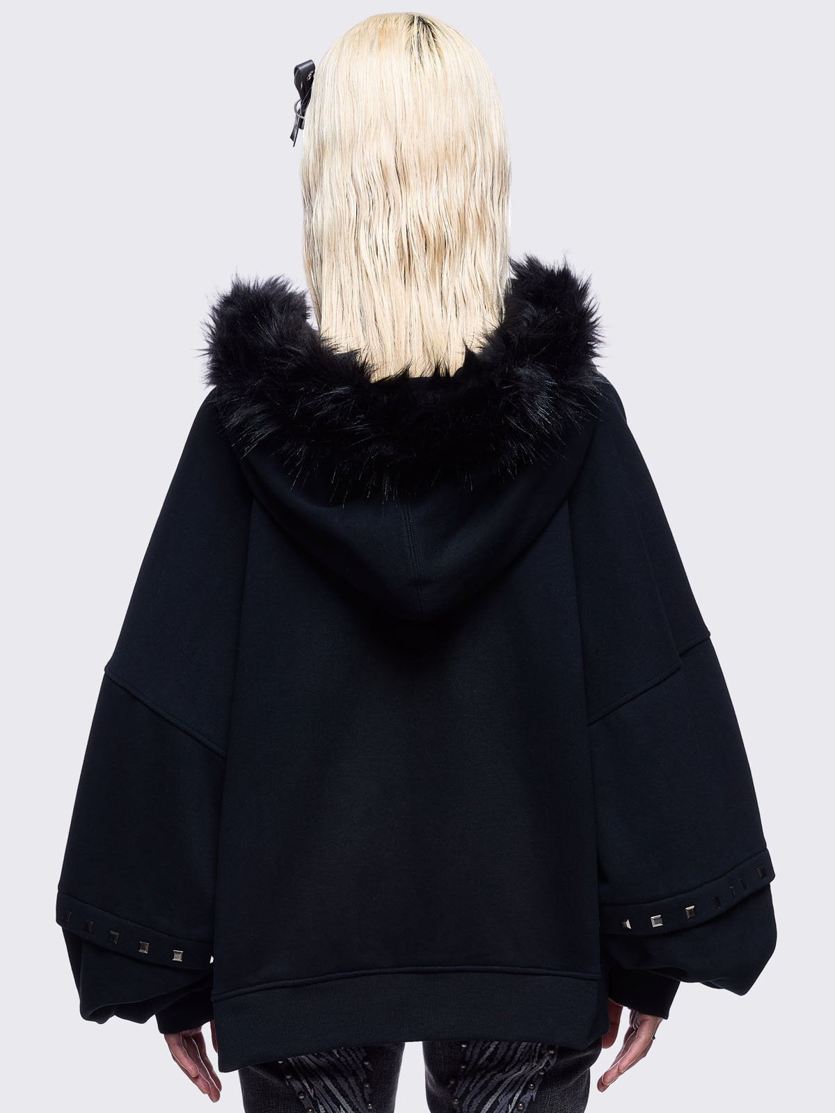 Black zip up hoodie jacket with faux fur hood with silver studded cross.