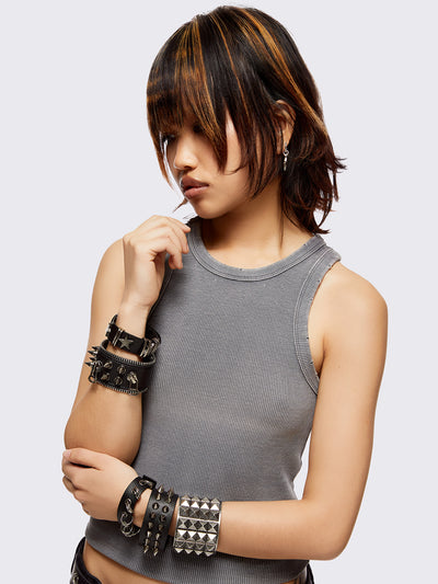 Set of 5 PU bracelets with mix of spikes, stars, zippers and studs. 