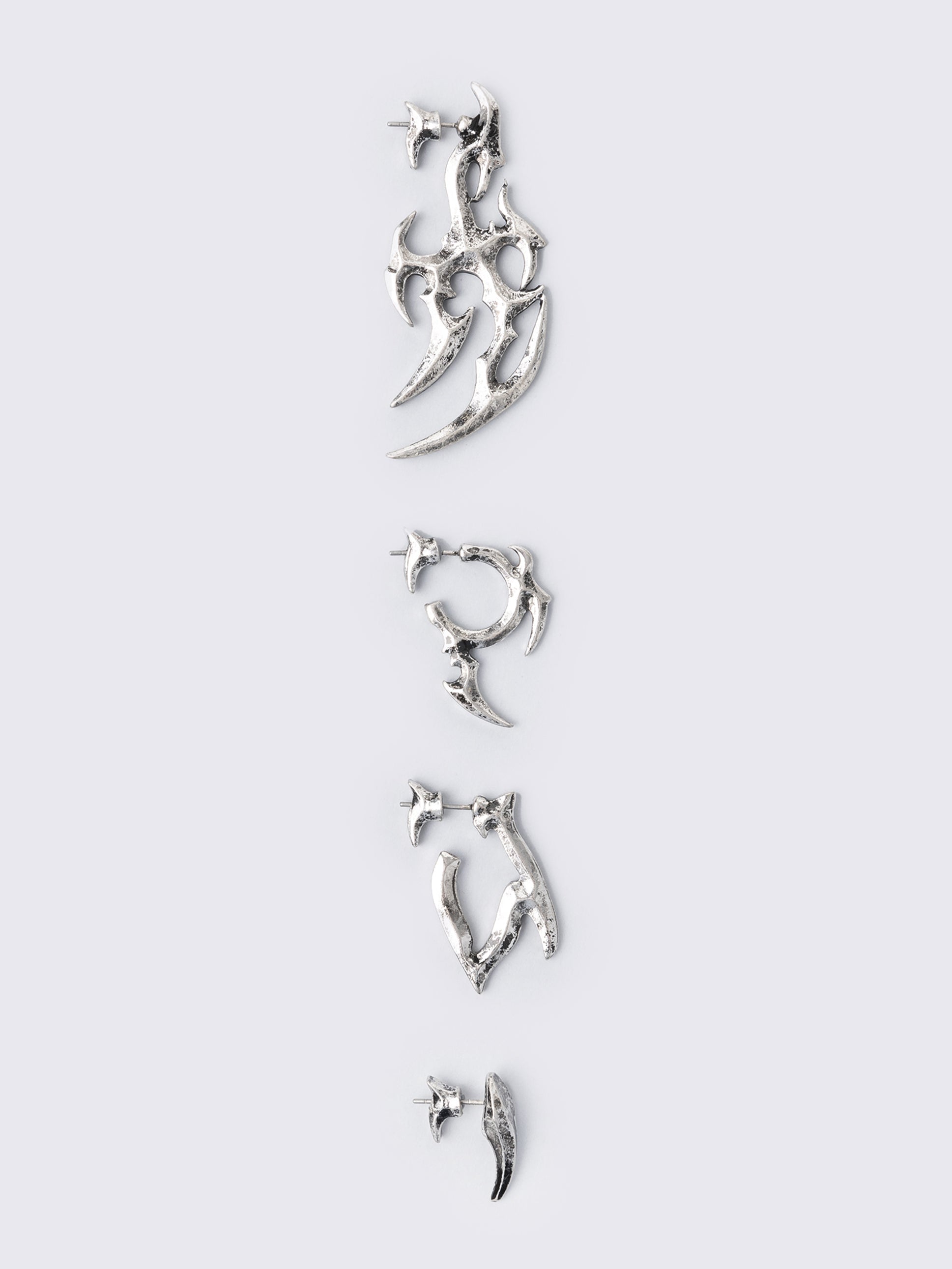 Silver 4pc chunky earring set in sigilism design.